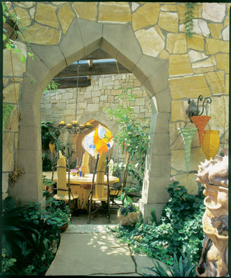 The brilliant colors of Boulder artist Matt Bezark's hand-poured glass window contrast with the yellow Colorado sandstone. Woodworker Rick Maddox fashioned the tables and chairs from cast-off cottonwood.